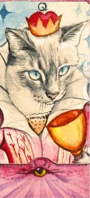 A queen card, a pale siamese cat in a red crown beside a golden cup