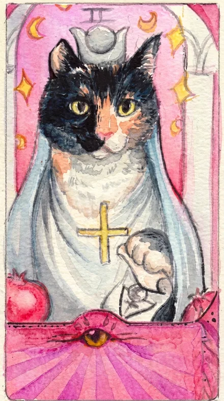 A tarot card numbered two, a calico cat in a white robe with a gold cross and a pomegranate