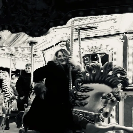 Sara Gilbreath on a carousel